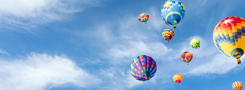 Virgin Balloon feature image - hot air balloons in a blue sky