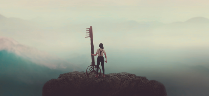 A misty landscape scene with a woman holding a big key