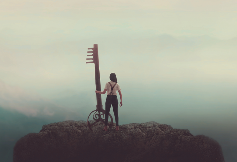 A misty landscape scene with a woman holding a big key