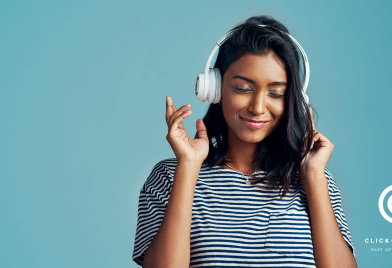 Woman with headphones listening to music